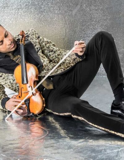 G Pinto - gold suit lying on floor